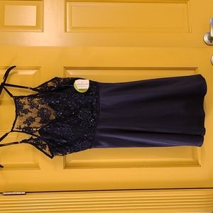 New with tags semi-formal dress, size 7, royal/navy blue.